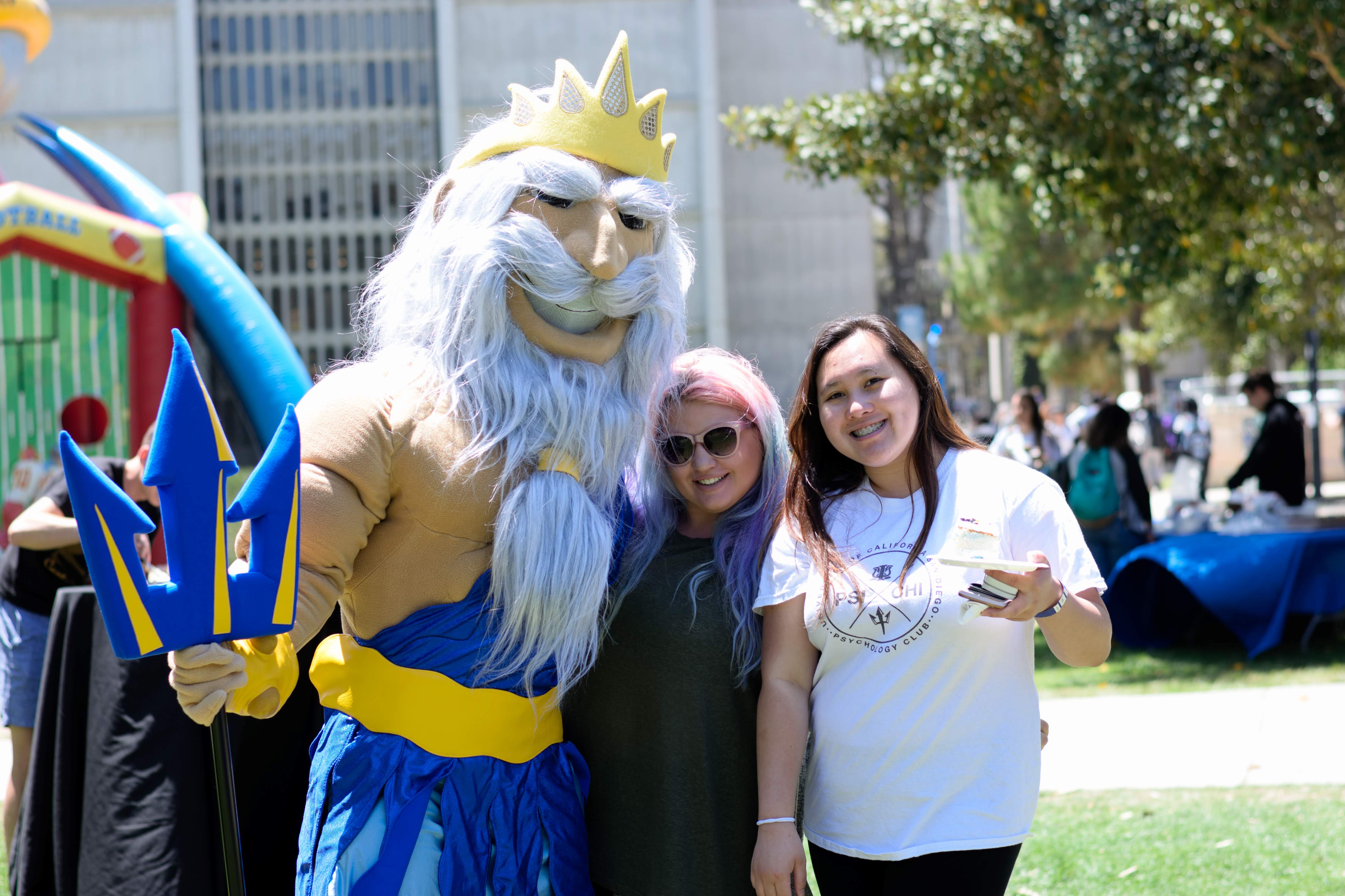 King Triton poses with Psi Chi students