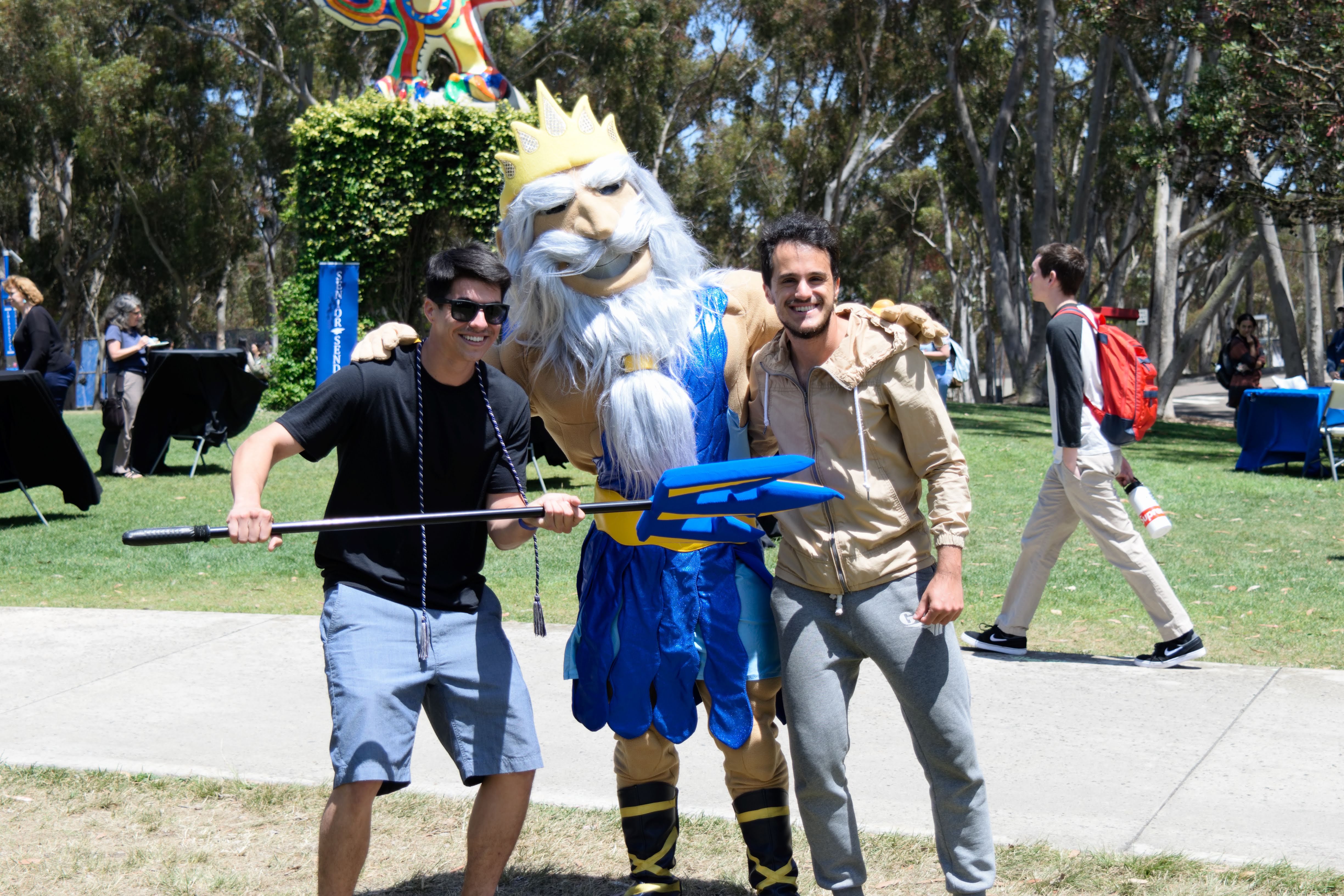 King Triton poses with Psi Chi students