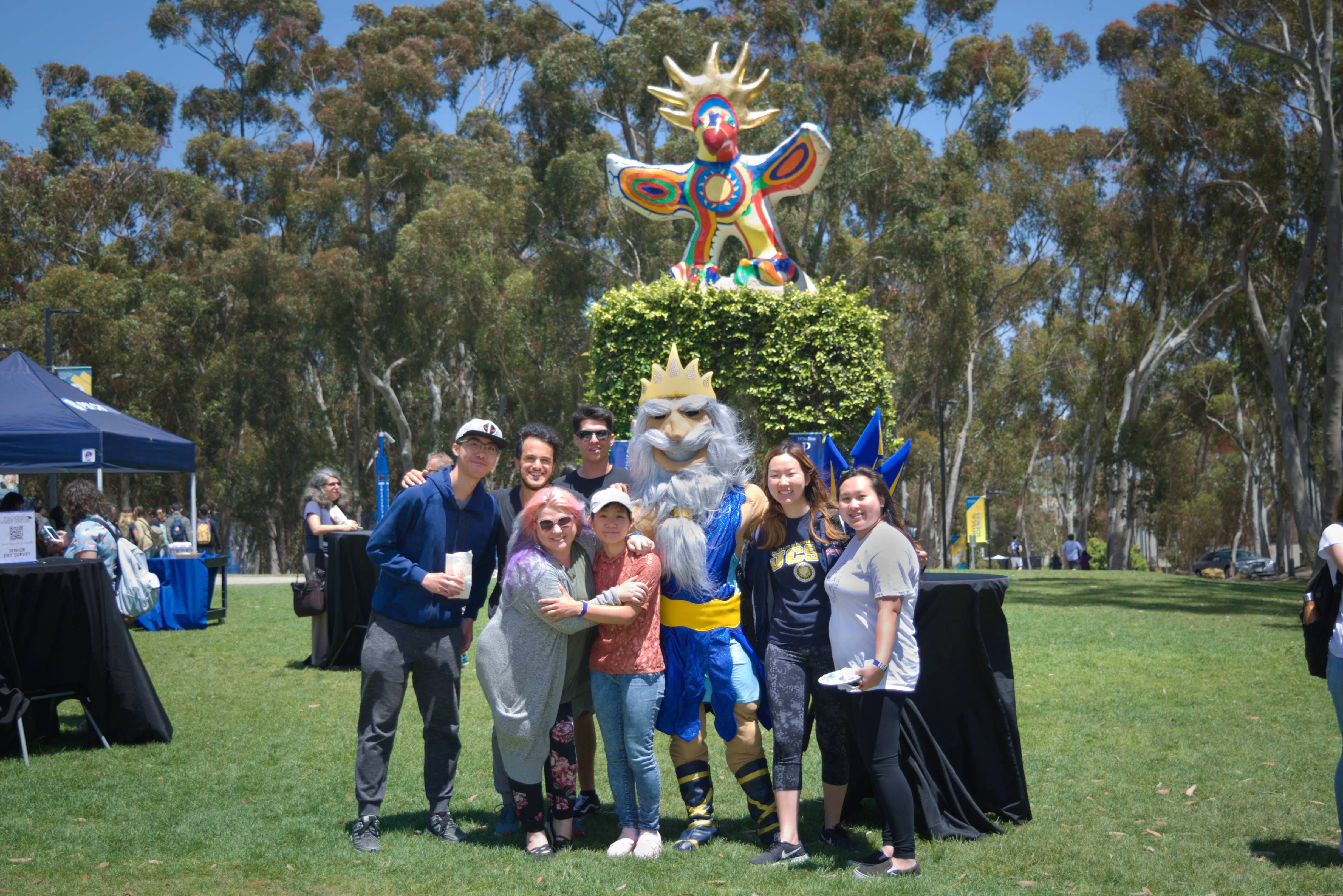 King Triton poses with Psi Chi students