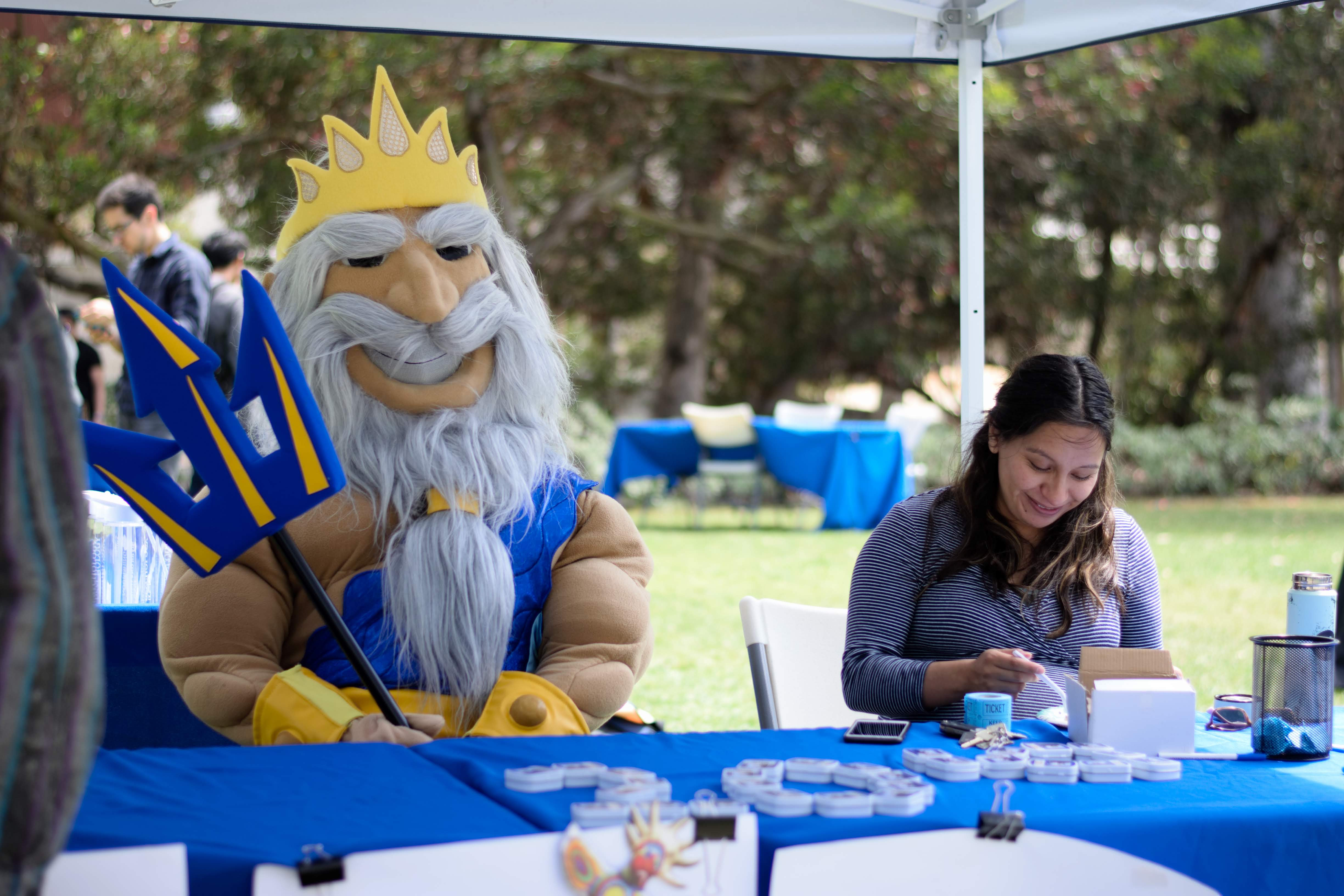 King Triton poses with staff at Psychology Senior Send-Off 2019