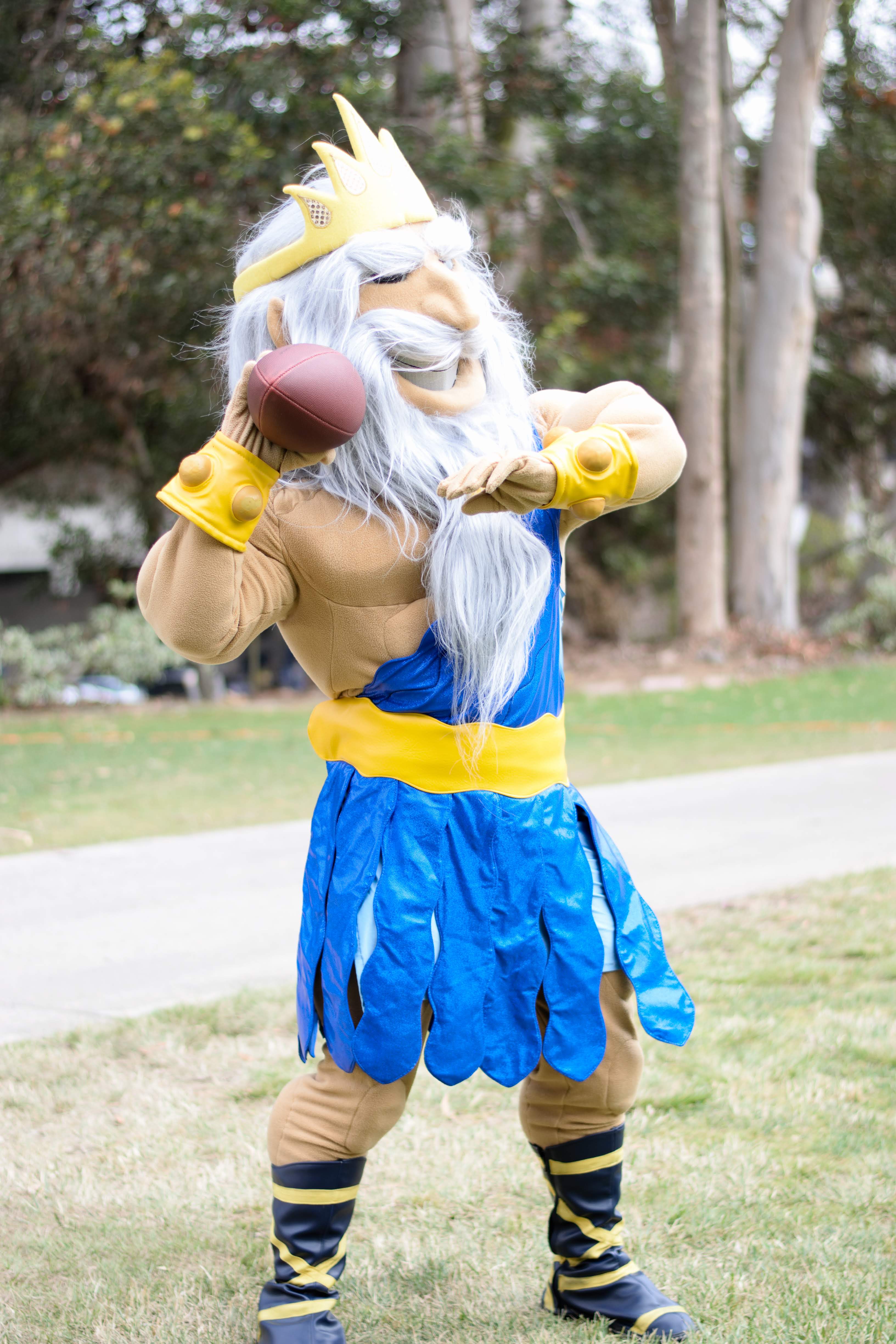 King Triton throws a football at Senior Send Off