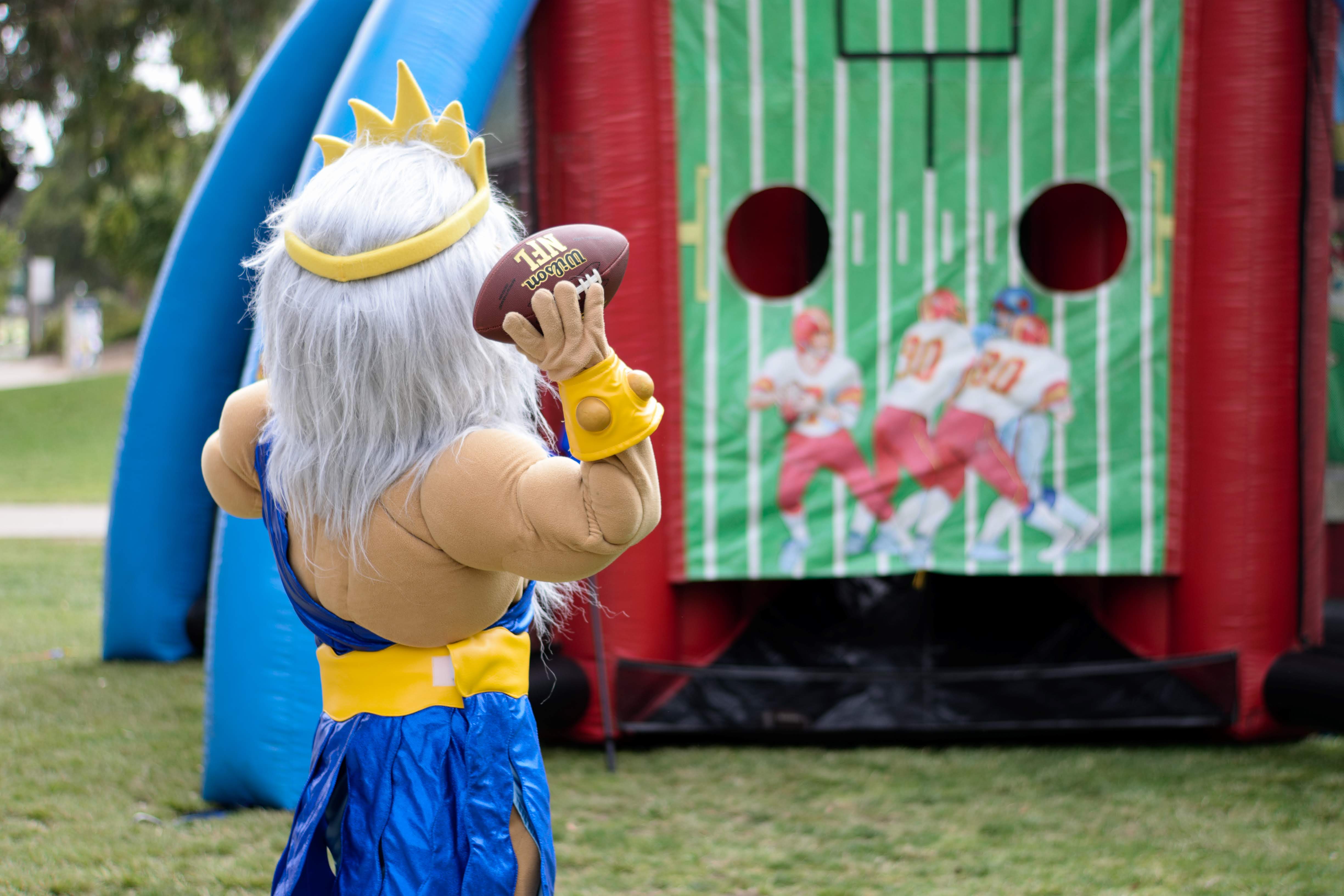 King Triton throws a football at Senior Send Off 2019